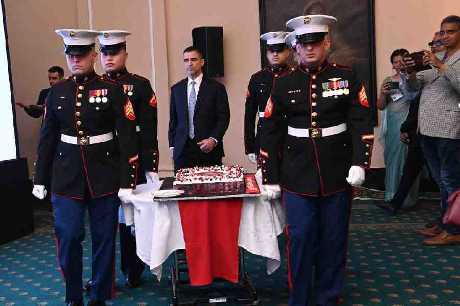 The cake being brought in by the Marines