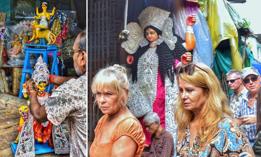 Last-minute touches being lent to idols of goddess Jagaddhatri in Kumartuli even as (right) foreigners roam the potters’ neighbourhood on Saturday 