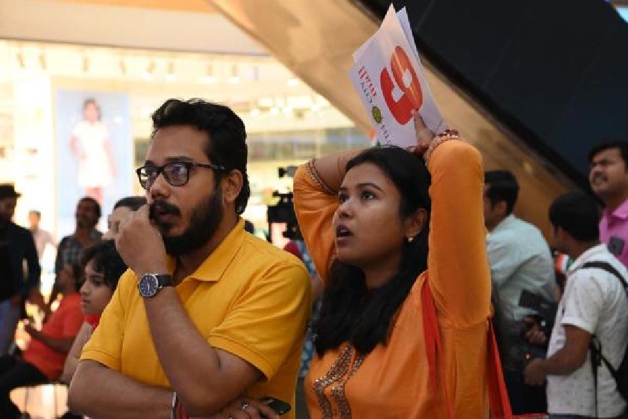 Anxious faces at the atrium of South City Mall, where visitors watched the match on a giant screen