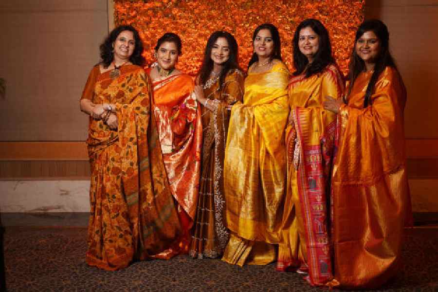(L-R) Dr Kokila Banerjee, Dr Shweta Kothari, Dr Indrani Dasgupta, Dr Kalapi Chatterjee, Dr Shelley Ganguly and Dr Nandini Ray pose against the yellow chrysanthemum floral background