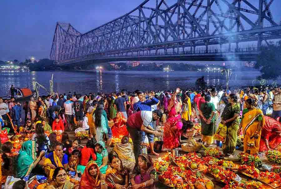 Standing in waist-deep water, devotees finish marking Chhath Mahaparv ending the 36-hour-long fast that continued throughout Sunday night till the sunrise on Monday 