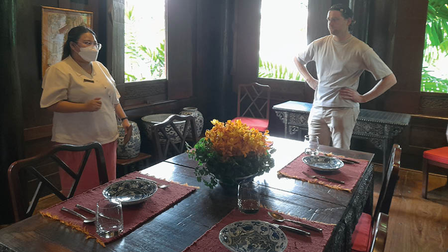 The guide and a guest at the dining hall of Jim Thompson House