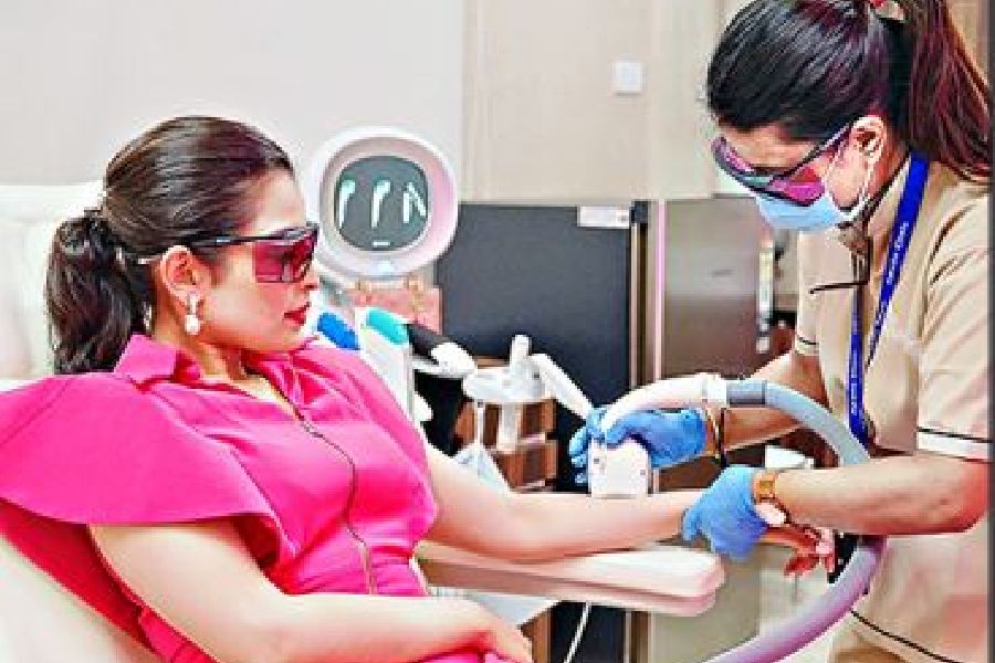 A woman undergoes hair removal treatment at Apollo Cosmetic Clinic in New Town