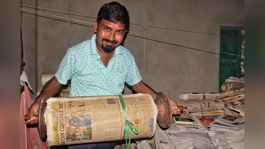 Dinanath Paul has compiled newspapers into scrolls arranged by subject, like one about Lionel Messi. ‘You will find history in my scrolls, from Pele to Maradona, and Sridevi to Ajmal Kasab,’ he says