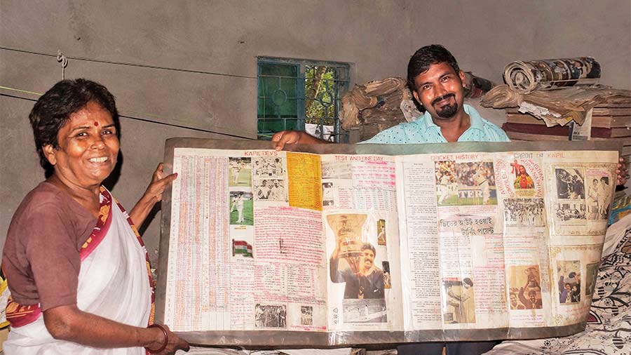 Dipika and Dinanath with his newspaper collection chronicling Kapil Dev's career