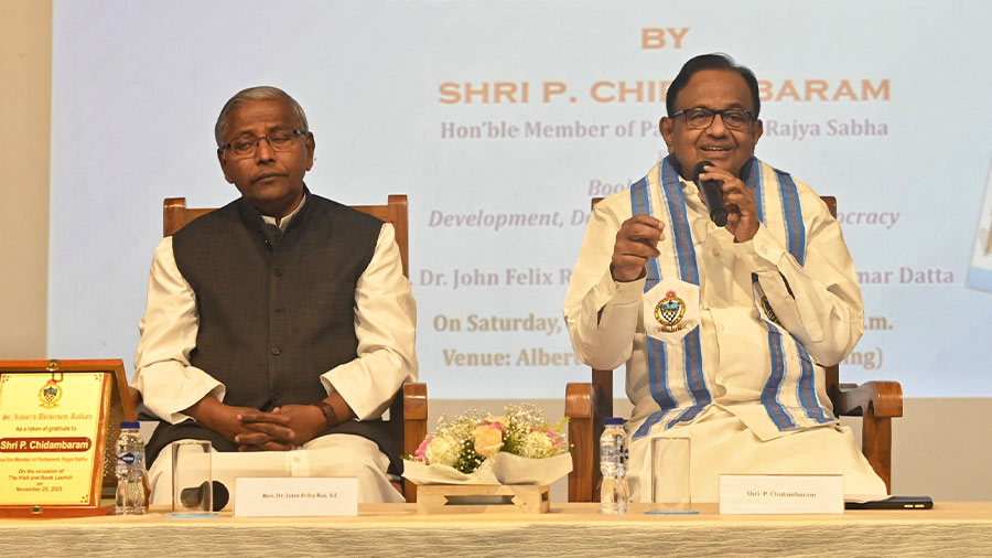 Rajya Sabha MP P Chidambaram speaks at a special lecture on ‘The Future of Democracy’ and launch of the book ‘Development, Decentralisation and Democracy’ by Father Felix Raj (left), at St Xavier’s University on Saturday