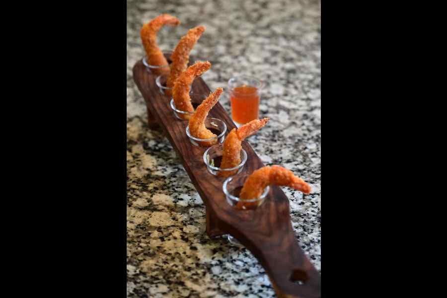 The go-to finger food, Prawn Magnets, are crispy on the outside with fresh prawn flesh inside, served with sweet chilli sauce. Rs 399