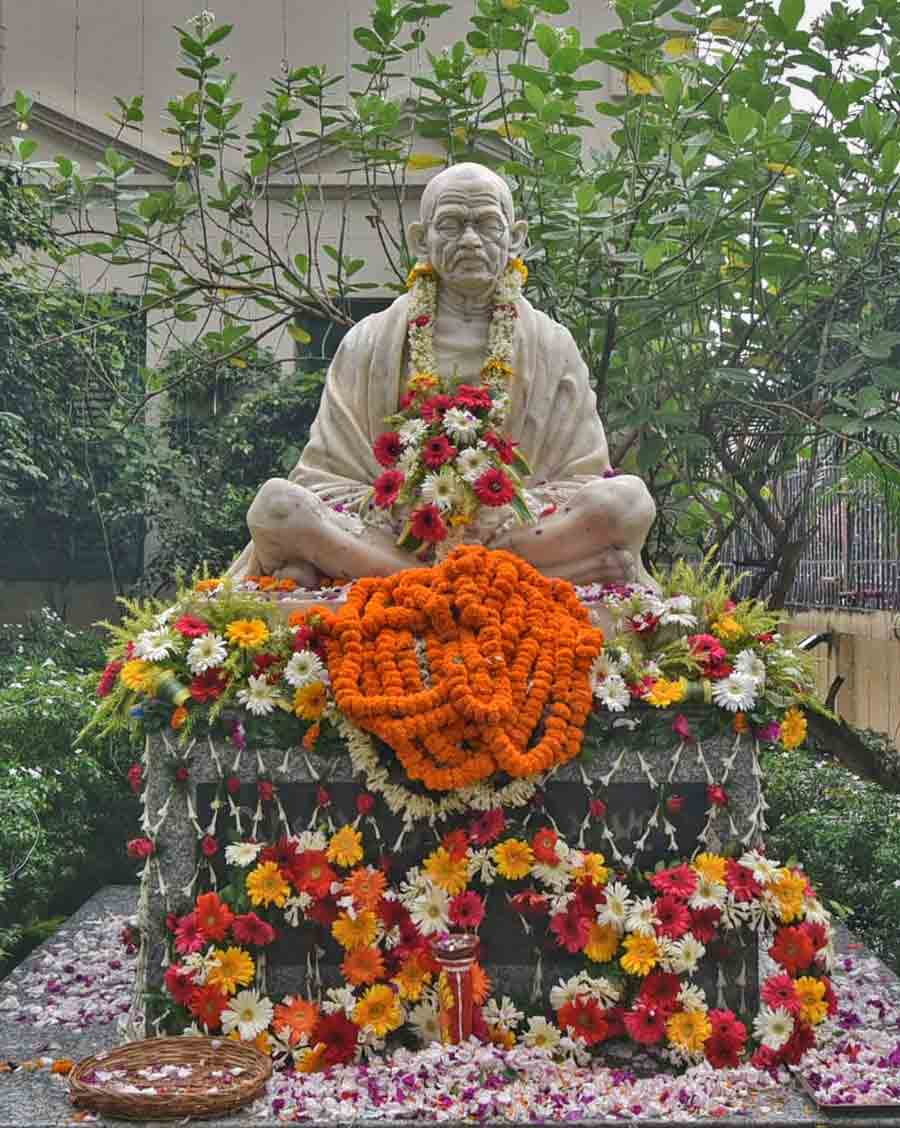 The garlanded statue of Mahatma Gandhi at Beliaghata Gandhi Bhavan on his 153rd birth anniversary on Monday