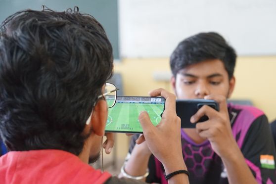 Players fighting for the Winning trophy in E-football event.