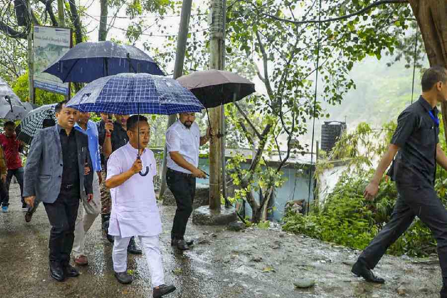 Sikkim Chief Minister Prem Singh Tamang takes stock of the situation after flash floods following a cloud burst in Singtam, Sikkim.