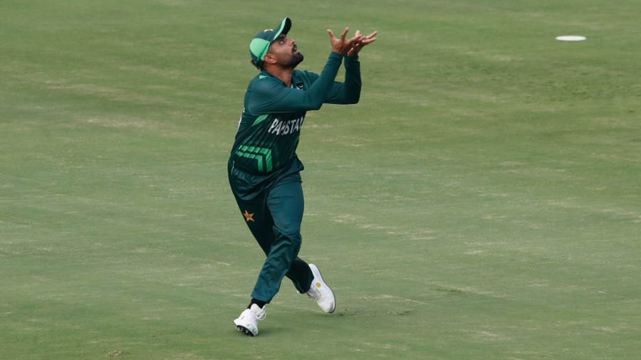 Babar Azam of Pakistan takes a catch to dismiss Glenn Maxwell of Australia during the ICC Men's Cricket World Cup India 2023 warm up match 