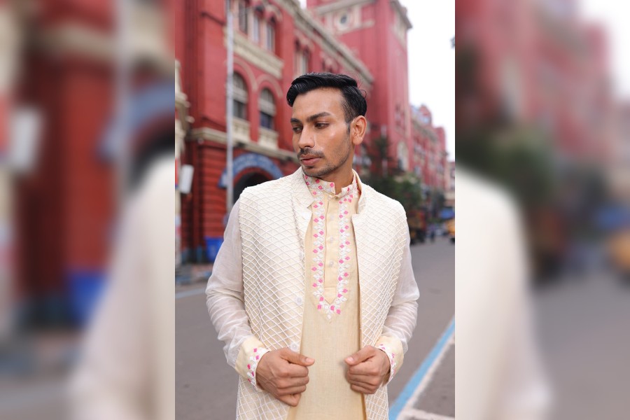 The beaded jacket over a long kurta with linear embroidery on the yoke and sleeves is for the man with sophisticated sartorial choices.