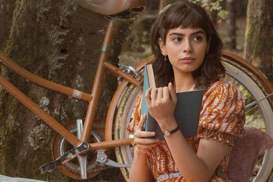 Betty Cooper, played by Khushi Kapoor, is all for love and cakes. The 22-year-old actress wore a breezy orange-and-ivory dress and held a book in her hands.