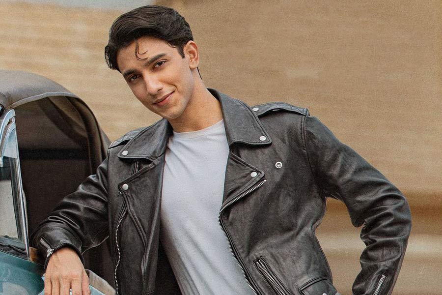 Vedang Raina, who plays Reggie in the film, sports a black leather jacket and poses in front of a vintage car in his character poster. 