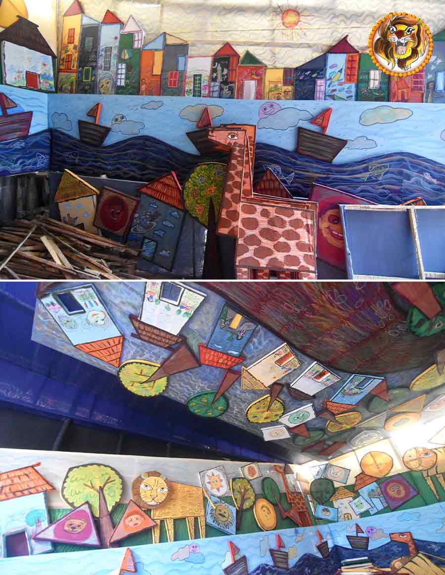 The theme for Darpanarayan Tagore Street Pally Samity is ‘Kham Kheyali’ (fancy-free). Bright cut-outs of buildings, wild animals and various other objects extend from the side-panels to the ceilings giving an immensely positive feeling  