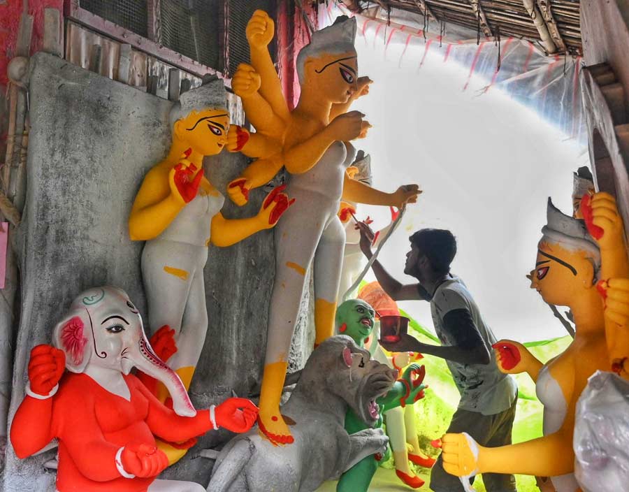 With barely two weeks for Durga Puja to start and Kolkata getting pounded by end-monsoon rain for over 10 days, artisans in Kumartuli are racing against time to finish the idols by applying the final coat of paint under the protection of polythene sheets