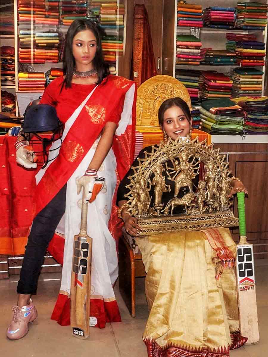 Models on Thursday dressed up in traditional puja sarees and flaunted cricket gear at Mriganayani in Dakshinapan shopping complex to mark Durga Puja and The ICC Men’s Cricket World Cup 