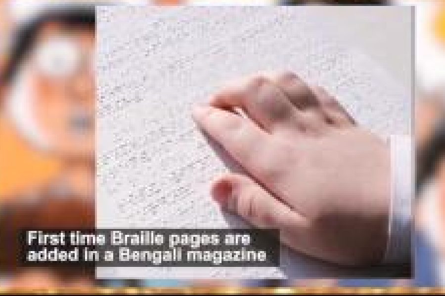 A still from a video by the child rights commission on the magazine Hullor shows a child reading a poem in Braille