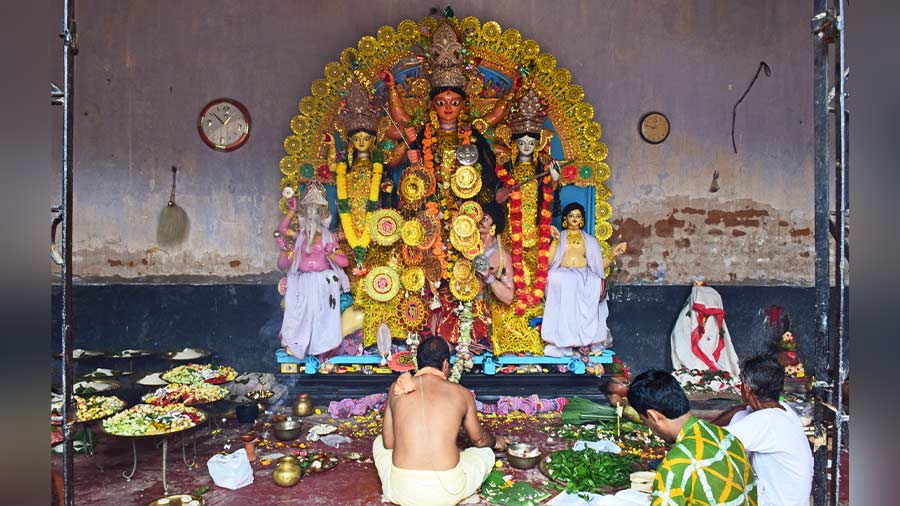 Goddess Durga, Lakshmi and Saraswati decked up in golden foils 