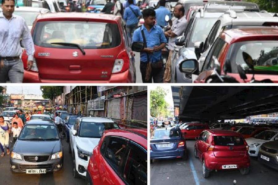 Cars parked on Park Street and (below) in Gariahat on Saturday. The Telegraph was overcharged for parking at both places on Saturday evening and the parking attendants did not issue receipts
