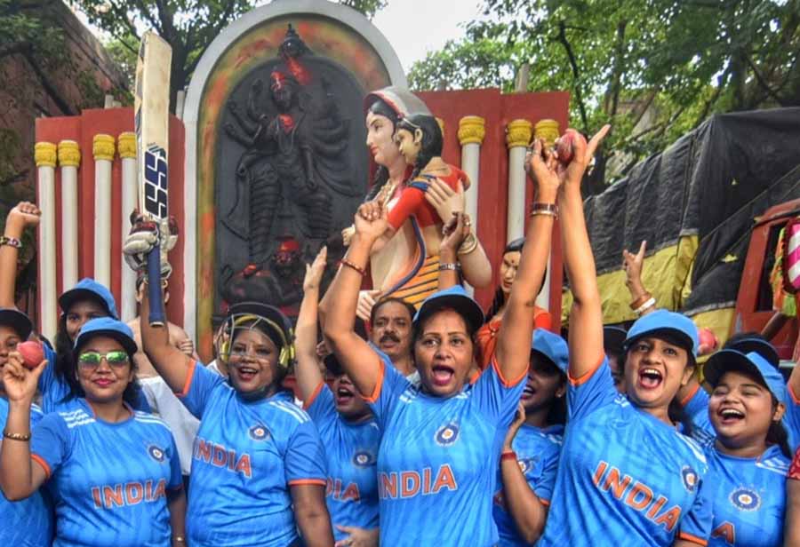 Dressed in cricket uniforms with bats and flags, women of Pathuriyaghata Pancher Palli are bringing Durga idol from Kumartuli to mark the first match of India in World Cup on Sunday  