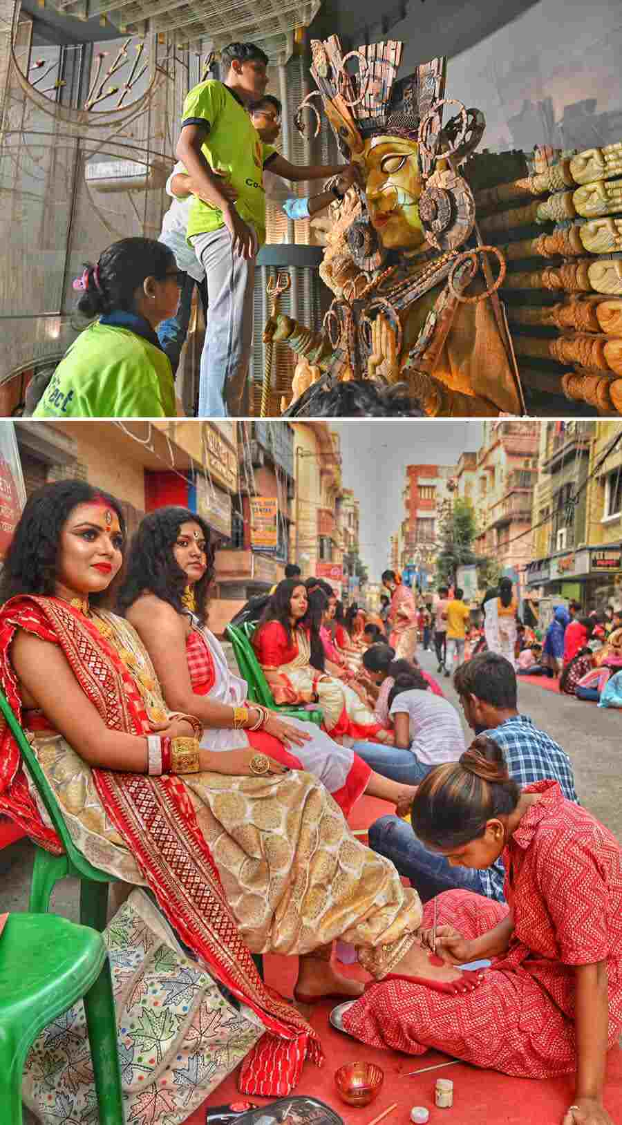 Visually impaired artists perform ‘Chokkhu Daan’, the ritual of painting the eyes of goddess Durga idol, at Rail Pukur United Club, Baguiati, on Monday. Additionally, 108 artists applied ‘alta’ on the feet of 108 women