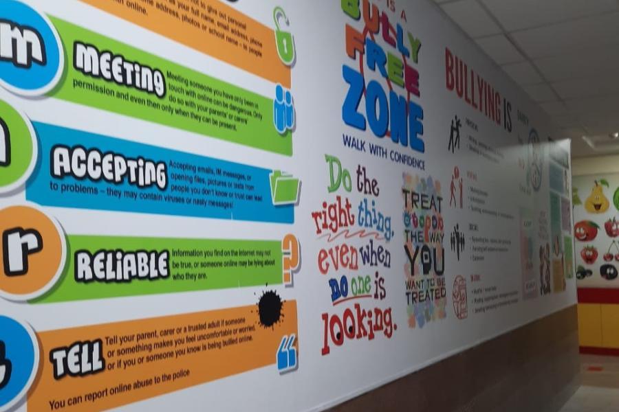 A wall at Mahadevi Birla World Academy painted with messages against bullying and for smart use of the internet.