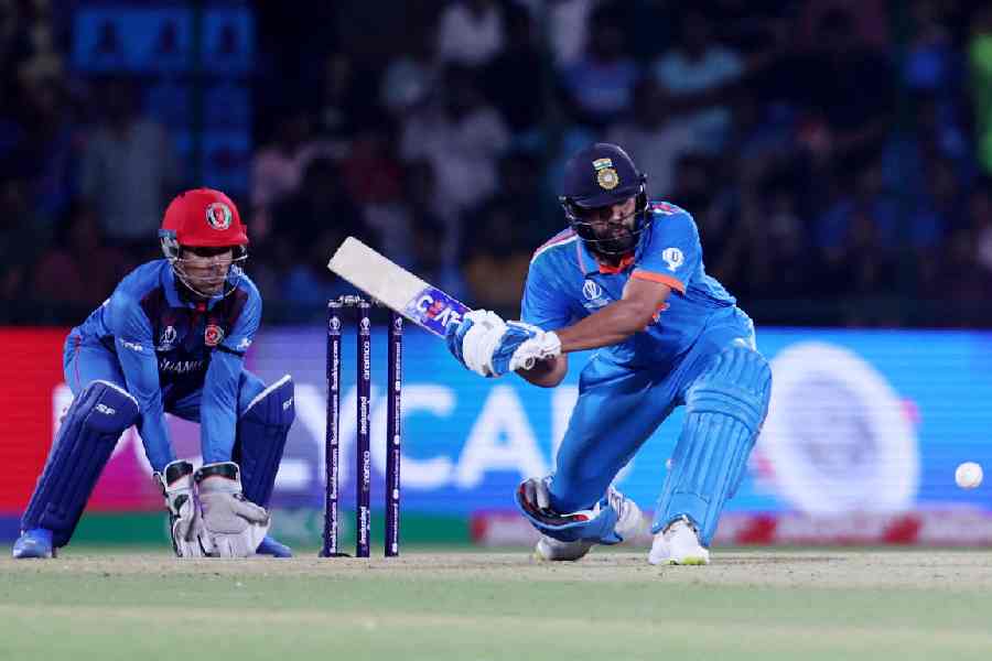 India's Rohit Sharma in action as he hits four runs.
