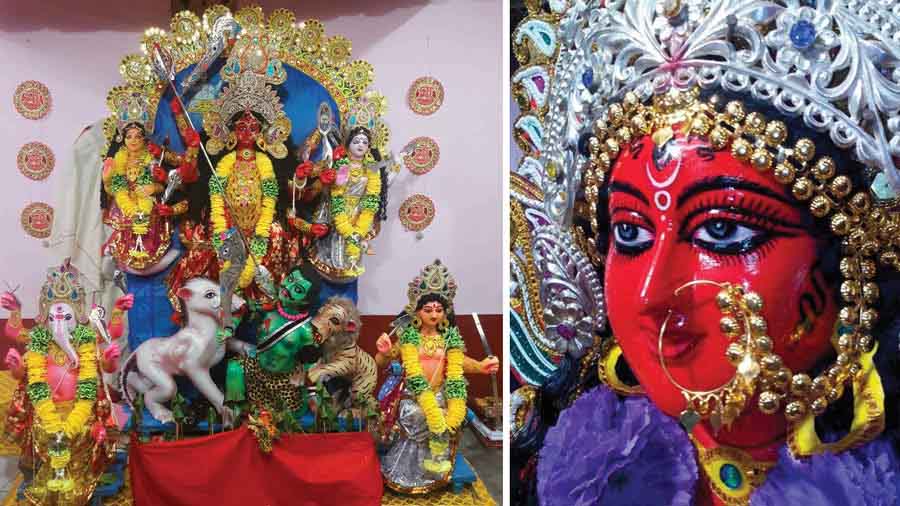 Red Durga sits on a tiger at Mustafi family puja in Cooch Behar’s Dinhata