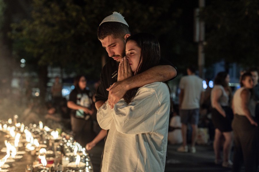 People at a candelight vigil in Tel Aviv for those killed in the war and for the Isaeli hostages held by Hamas on Thursday night, Oct. 12, 2023.