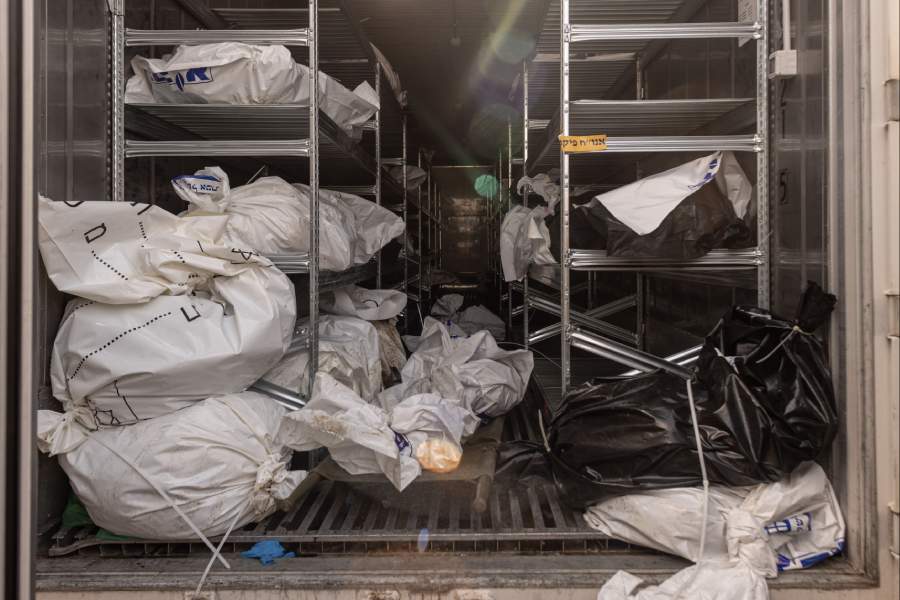 The bodies of Israelis killed by Hamas militants are gathered for identification at an IDF base in Ramla, Israel on Oct. 13, 2023. Hamas gunmen surged into Israel in a highly organized and meticulously planned operation that suggested a deep understanding of Israel’s military secrets and weaknesses.