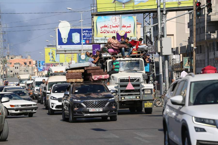 Vehicles laden with people and belongings navigate traffic on Salah El Deen Road, near Khan Younis in the southern half of the Gaza Strip, amid mass evacuations in the northern part on Friday, Oct. 13, 2023. Panic and chaos gripped the northern Gaza Strip Friday as thousands of people fled south along two main roads after the Israeli military ordered a mass evacuation of half of the besieged coastal strip.