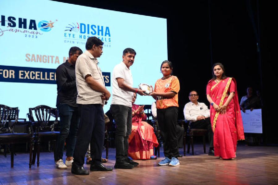 Footballers Sangita Metya and (right) Pratima Ghosh receive the Disha Samman on Friday