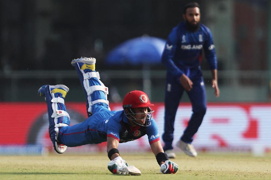Afghanistan's Rahmanullah Gurbaz is run out by England's David Willey
