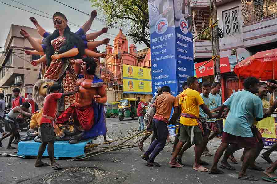 A Durga idol being ferried to its destination from Kumartuli on Friday, a day ahead of Mahalaya  
