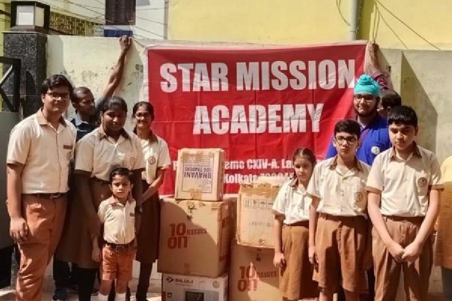 Students of Star Mission Academy with clothes, stationery and toys that will be distributed among underprivileged children 
