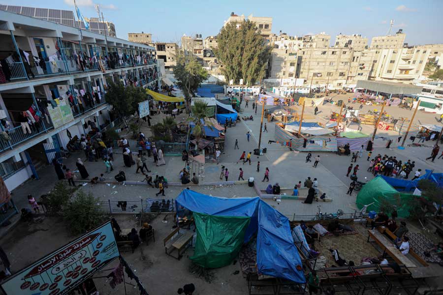 Palestinians displaced from the northern Gaza Strip fill the grounds of a United Nations-run school in Khan Younes on Saturday, Oct. 14, 2023. Hundreds of thousands of Gazans fleeing south in response to Israeli warnings struggled to find food and shelter on Saturday in an intensifying humanitarian crisis, with the United Nations saying that water supplies were dwindling.