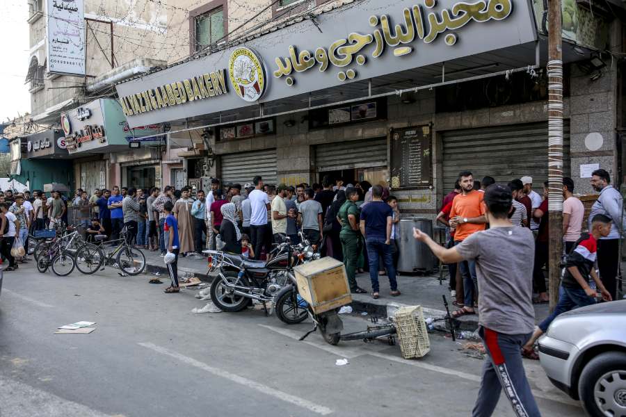 People line to buy bread and other supplies in Khan Younis, Gaza, on Oct. 15, 2023.