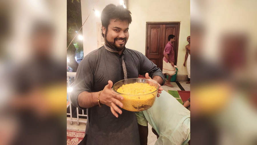 Sukrit with his Pujo favourite – Ghee Anna – at Dalal House