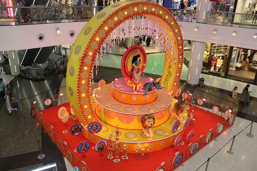 A large mandap-like structure greets visitors in the mall’s atrium. An idol of Durga with Mahishasur at her feet stands at the centre and the entire installation is decorated with painted ‘shoras’ depicting the many forms of the goddess