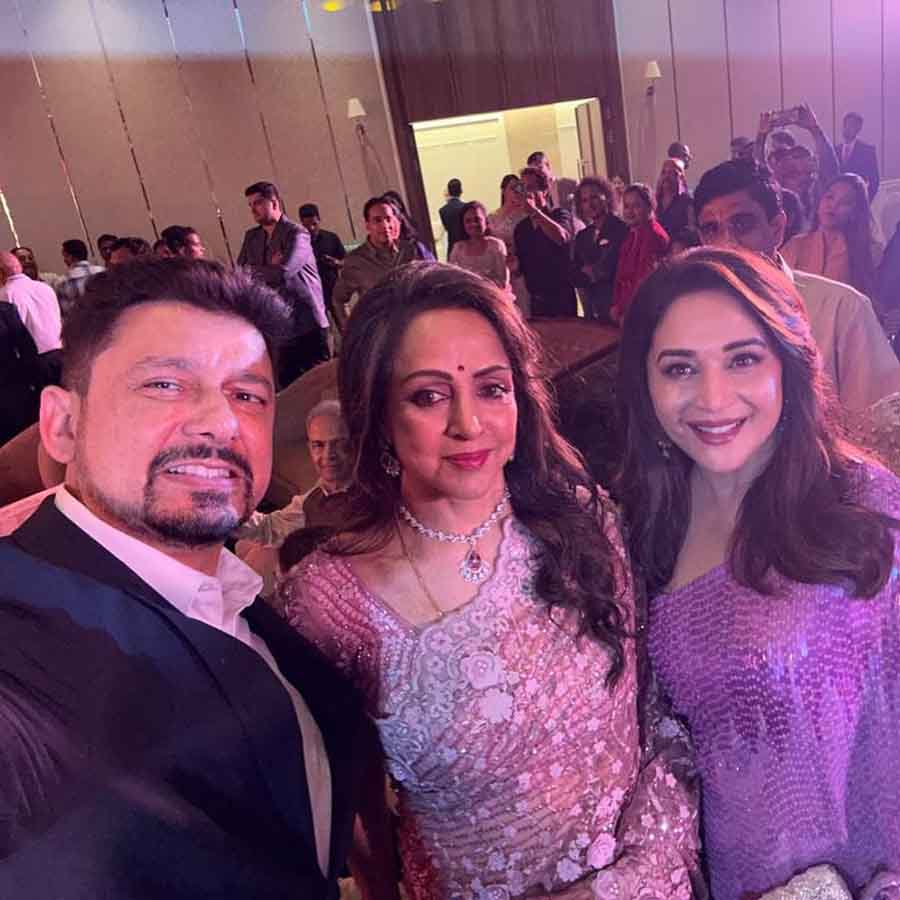 Madhuri Dixit attended the birthday bash with her husband Dr Shriram Nene. The 56-year-old actress wore a shimmering violet sari and went for a wavy hair look.