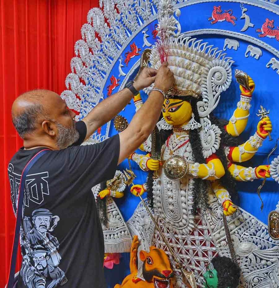 Actor and wildlife conservationist Joydip Kundu arranged the weapons in the hands of Durga idol at his residence Kundu Bari Durga Puja at Hatibagan on Wednesday  