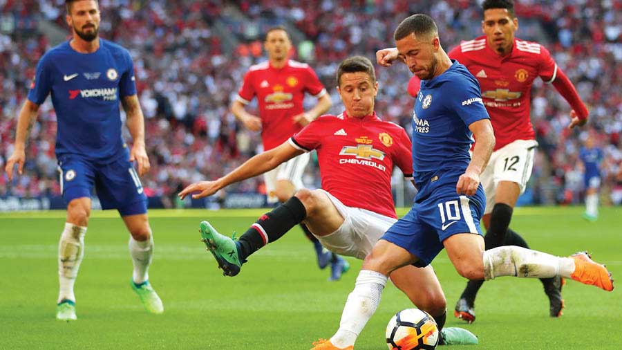 Hazard taking on Manchester United players in the 2018 FA Cup final