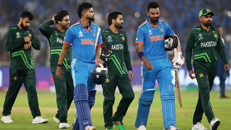 Shreyas Iyer and K.L. Rahul and walk off the field alongside the Pakistani players after India beat Pakistan convincingly in their latest World Cup fixture in Ahmedabad on Saturday