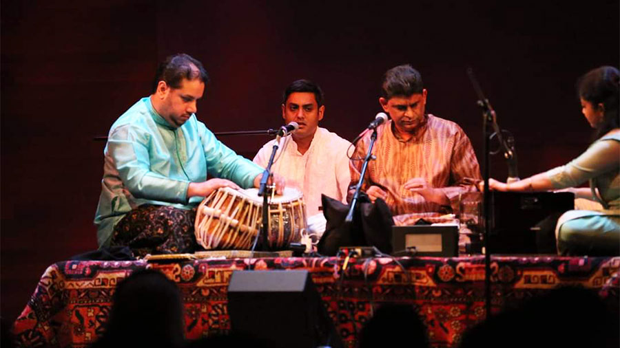 Dibyo Basu (second left) on stage alongside Banerjee