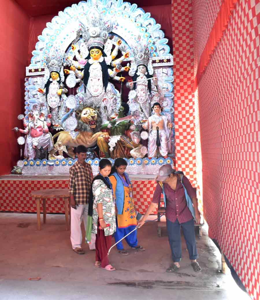 The workers of Kolkata Municipal Corporation (KMC) carried out vector control at Durga Puja pandals to prevent dengue 