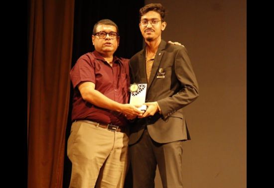 UG student co-convenor Debopriyo Chakraborty being awarded by convenor Dr. Arup Kumar Mitra