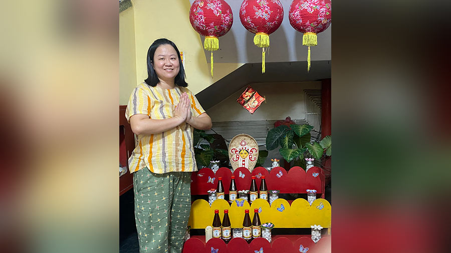 Janice Lee in the Pou Chong store in Tiretti Bazar, decorated with an artwork of Durga and Chinese lanterns. ‘I am an Indian-Chinese at heart who wholeheartedly embraces Bengali traditions,’ she says
