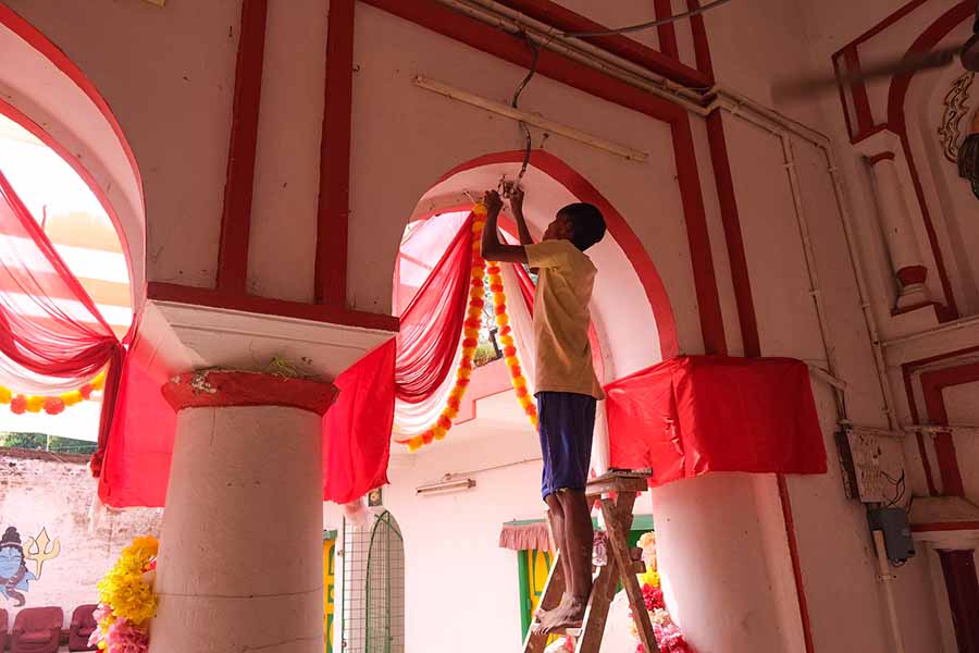 Diligent workers meticulously craft the final touches of the opulent house decorations,