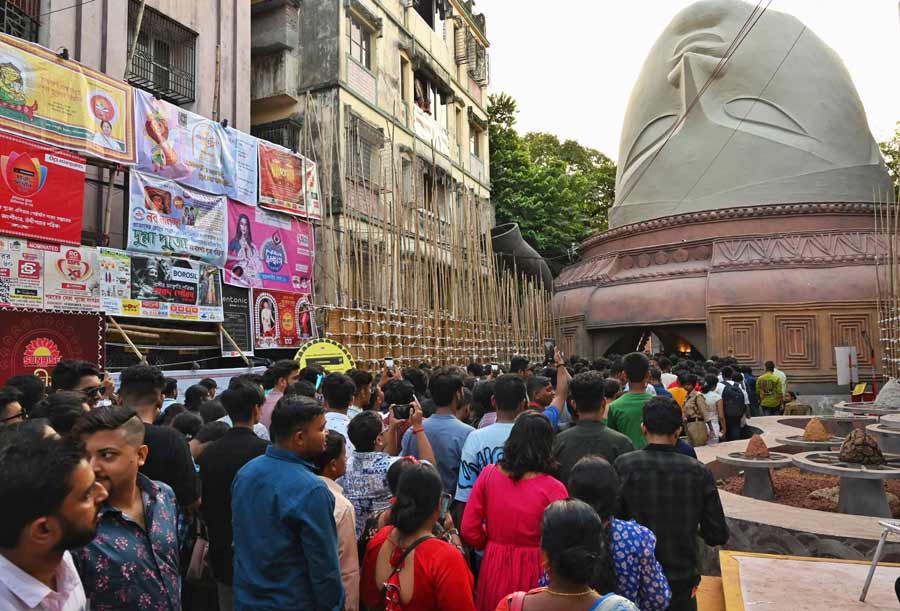 A giant head of Durga is the pandal at the 66 Pally puja in Kalighat. The puja tells the story of the multifaceted deity’s creations, emphasising the truth of ‘maati’ (soil) and society